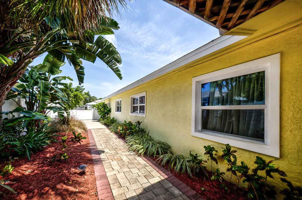 Footprints Beachside Recovery yellow residential house in Treasure Island, FL